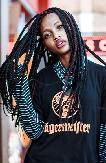 Woman with long black box braids in street style outfit – Braided Aura Nainital