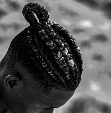 Man with braided hairstyle in a bun – Braided Aura Nainital